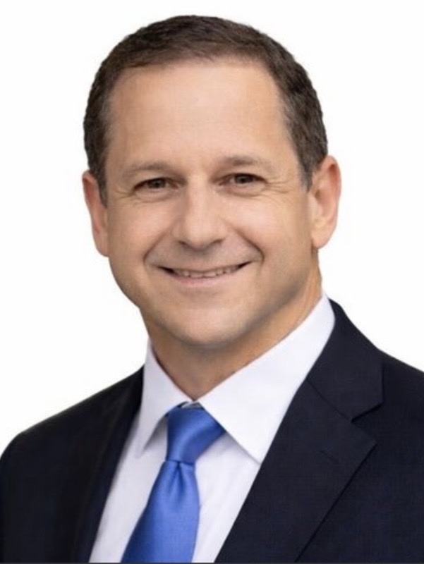 Professional headshot of Terry Curtis, Broker Associate at ERA Experts, smiling in a dark navy suit and blue tie.